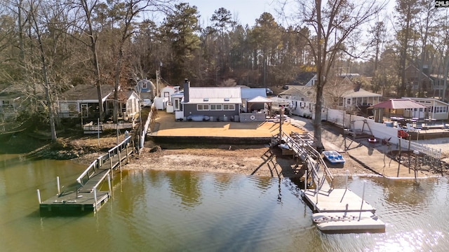 dock area featuring a patio area and a water view