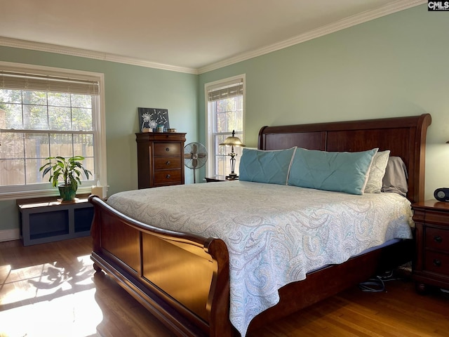 bedroom with hardwood / wood-style flooring and ornamental molding