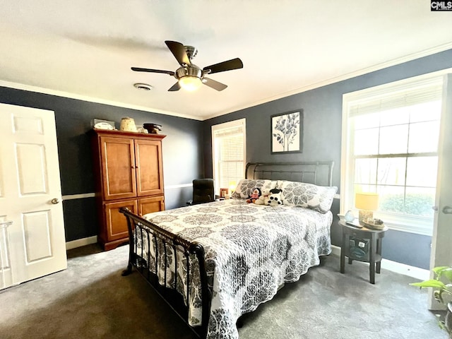 bedroom with crown molding, ceiling fan, and dark colored carpet