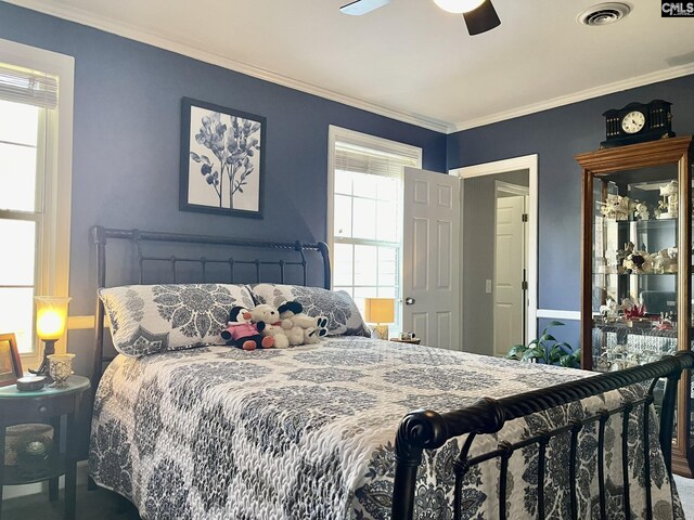 bedroom featuring ornamental molding and ceiling fan