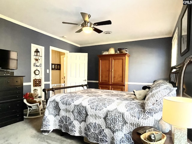 carpeted bedroom featuring crown molding and ceiling fan