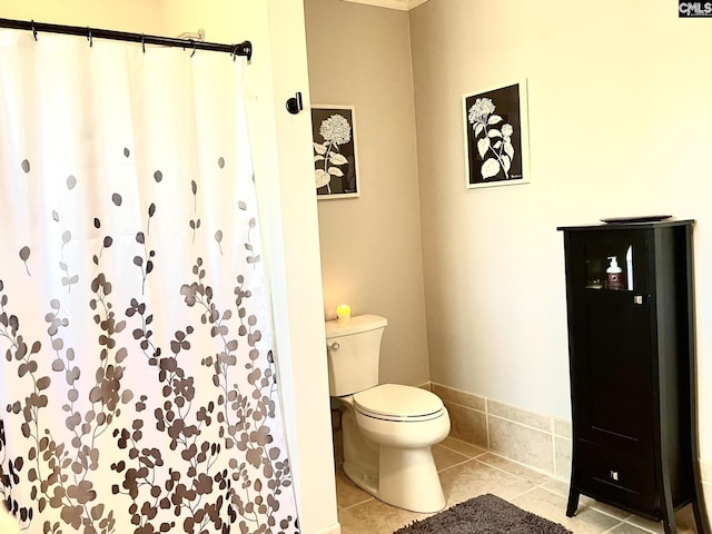 bathroom featuring tile patterned floors and toilet