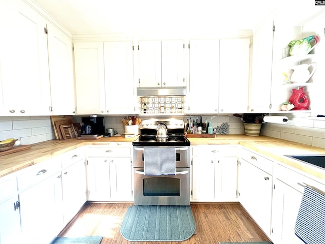 kitchen with backsplash, light hardwood / wood-style floors, range with two ovens, and white cabinets