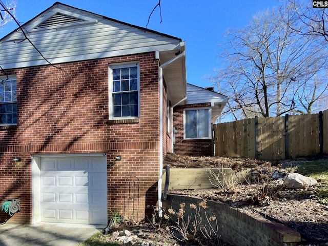 view of side of property featuring a garage