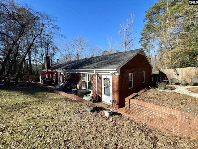 view of property exterior featuring a yard