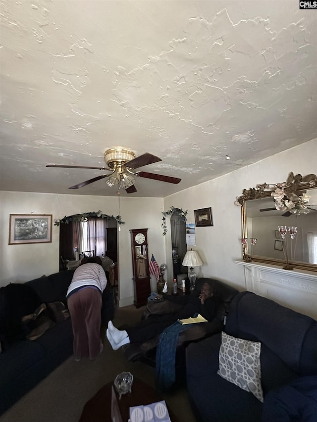 living area with a textured ceiling