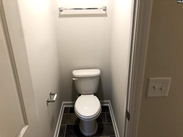 bathroom with tile patterned floors and toilet