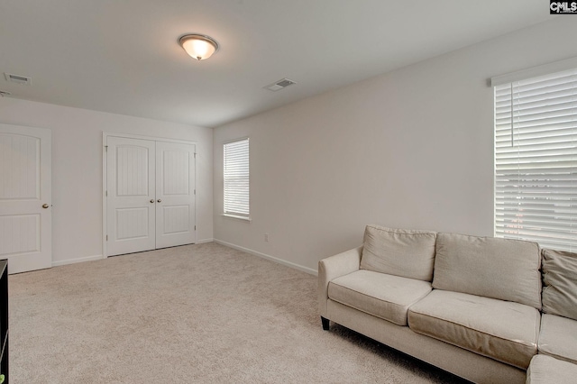 sitting room with light carpet