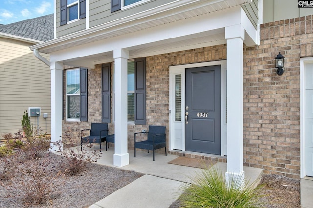 entrance to property featuring a porch