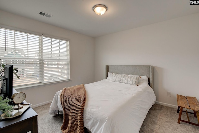 bedroom with light carpet