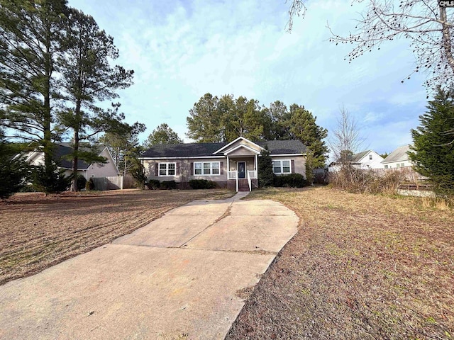 ranch-style home with a front lawn