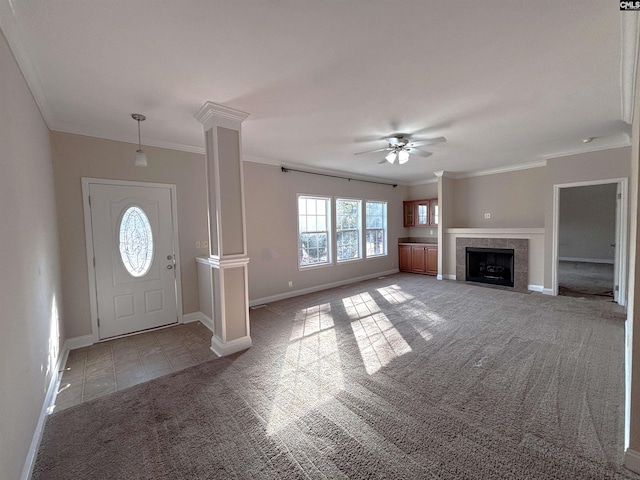 entryway featuring ornamental molding, light carpet, decorative columns, and baseboards