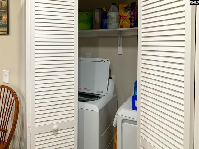 laundry area with washing machine and dryer