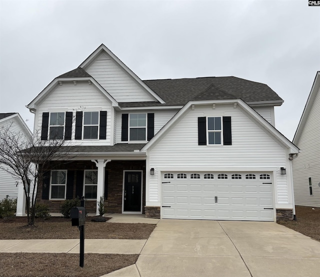 view of front of property with a garage