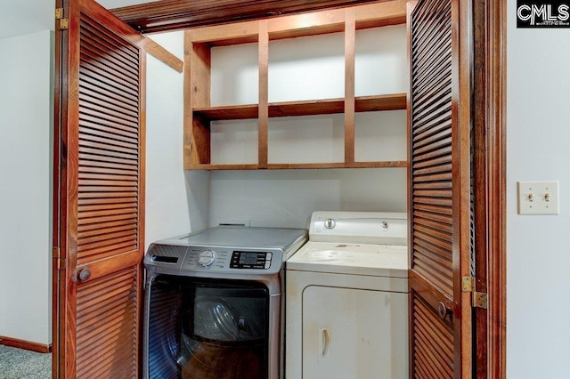 washroom featuring washing machine and dryer