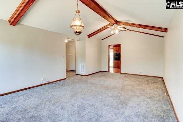 unfurnished living room with lofted ceiling with beams, ceiling fan, and carpet