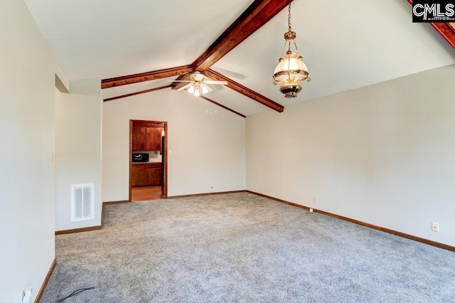 unfurnished living room featuring lofted ceiling with beams and carpet