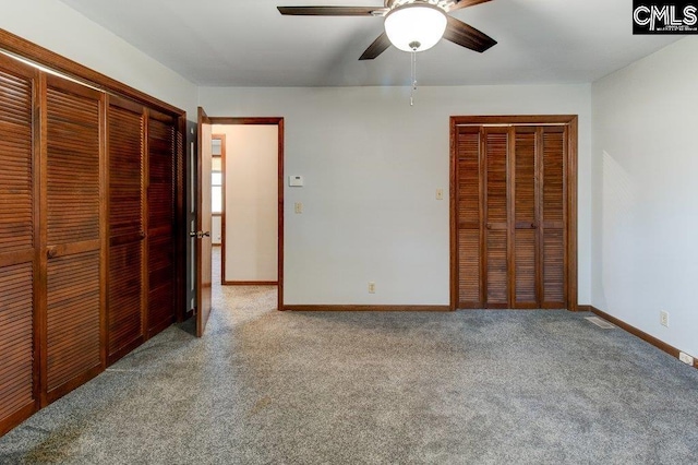 unfurnished bedroom with ceiling fan and carpet flooring