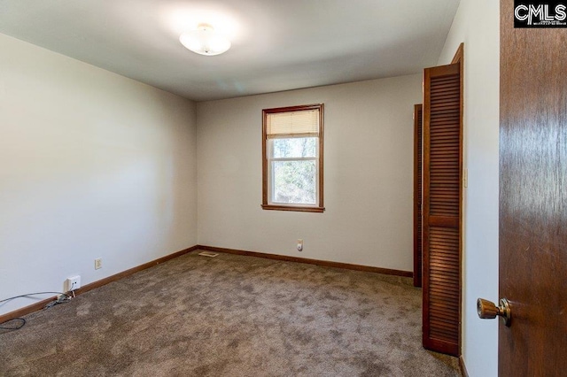 unfurnished room featuring carpet floors