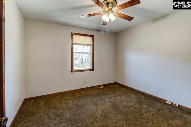 carpeted empty room featuring ceiling fan