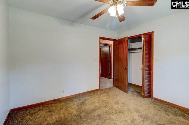 unfurnished bedroom with ceiling fan, a closet, and light carpet