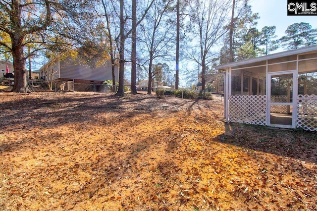 view of yard with a sunroom