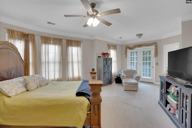 bedroom featuring crown molding, access to exterior, carpet floors, and multiple windows