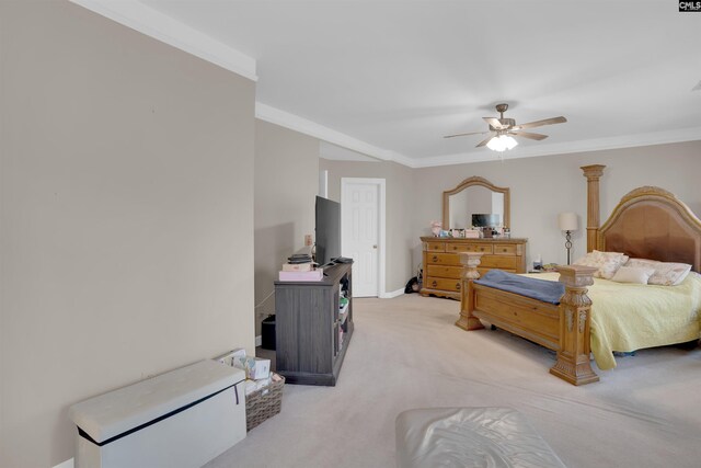 bedroom with light carpet, ornamental molding, and ceiling fan