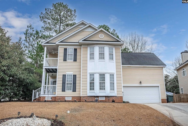 view of front of home featuring a balcony, a garage, and a front lawn