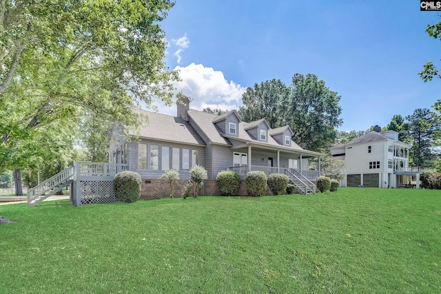 view of front of house featuring stairs, a front lawn, and a porch