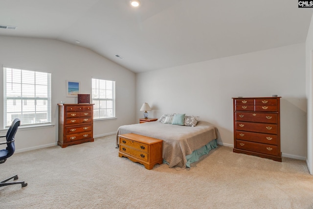 carpeted bedroom featuring vaulted ceiling