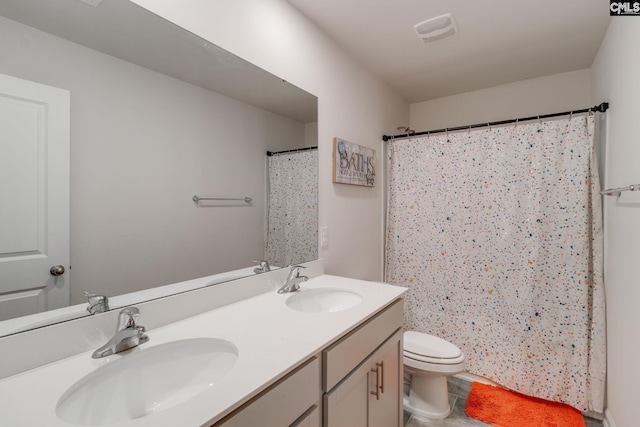 bathroom with vanity, toilet, and a shower with shower curtain