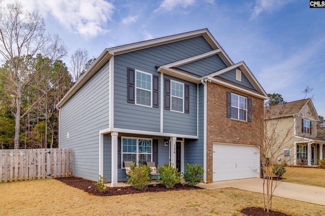 view of front of property featuring a garage and a front lawn