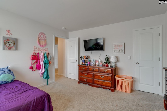 bedroom featuring light carpet