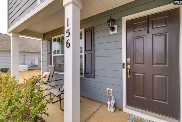 property entrance with covered porch