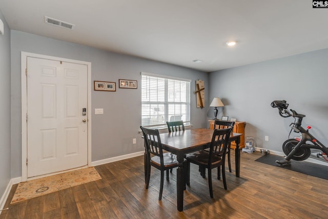 dining area featuring dark hardwood / wood-style flooring