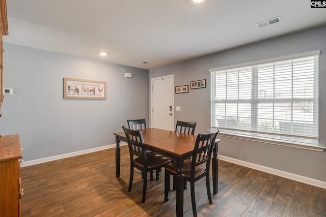 dining room featuring dark wood-type flooring