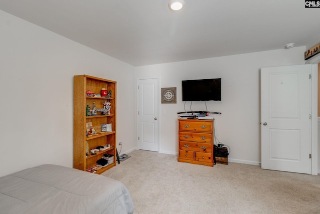 bedroom featuring light colored carpet