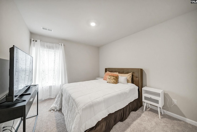 bedroom with light carpet