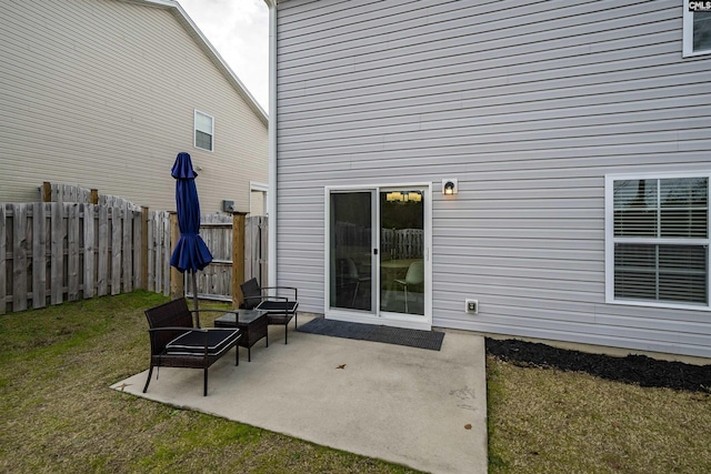 exterior space with a lawn and a patio area