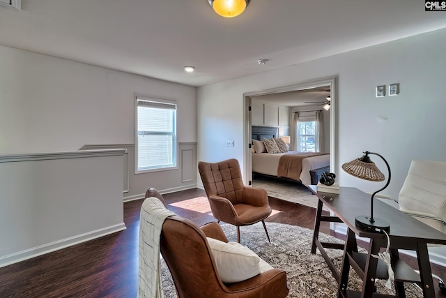 bedroom featuring dark hardwood / wood-style flooring and multiple windows