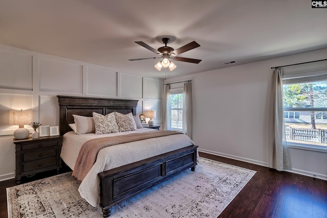 bedroom with hardwood / wood-style floors and ceiling fan