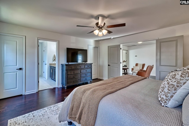 bedroom with ceiling fan, connected bathroom, and dark hardwood / wood-style floors