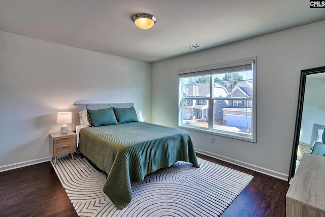 bedroom featuring dark wood-type flooring