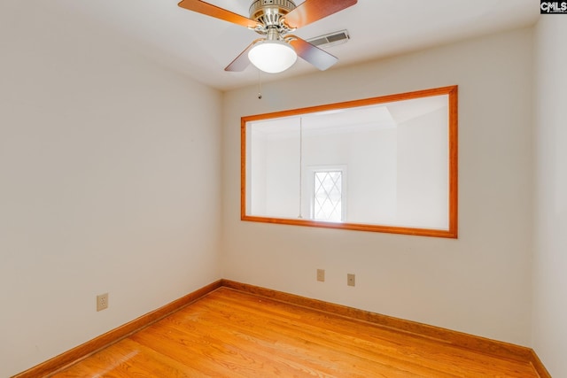 unfurnished room featuring ceiling fan and wood-type flooring