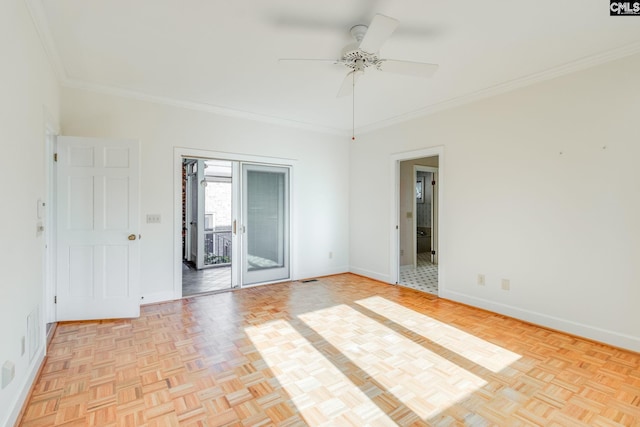 spare room with light parquet floors, crown molding, and ceiling fan