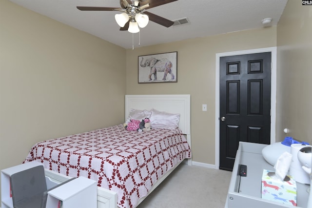 bedroom featuring light carpet and ceiling fan