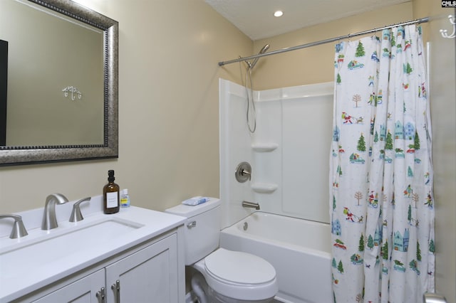 full bathroom with vanity, shower / tub combo, and toilet