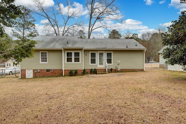 back of house featuring a yard