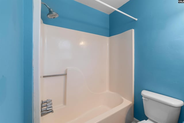 bathroom with shower / bath combination and toilet